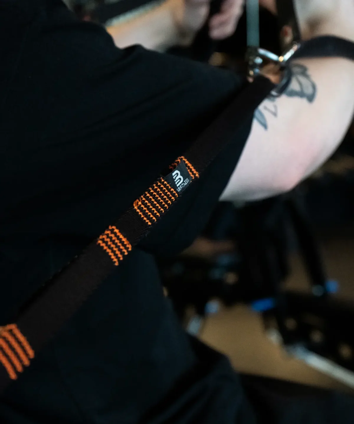 Daisy Chains fra Barfitness med sort og orange design.